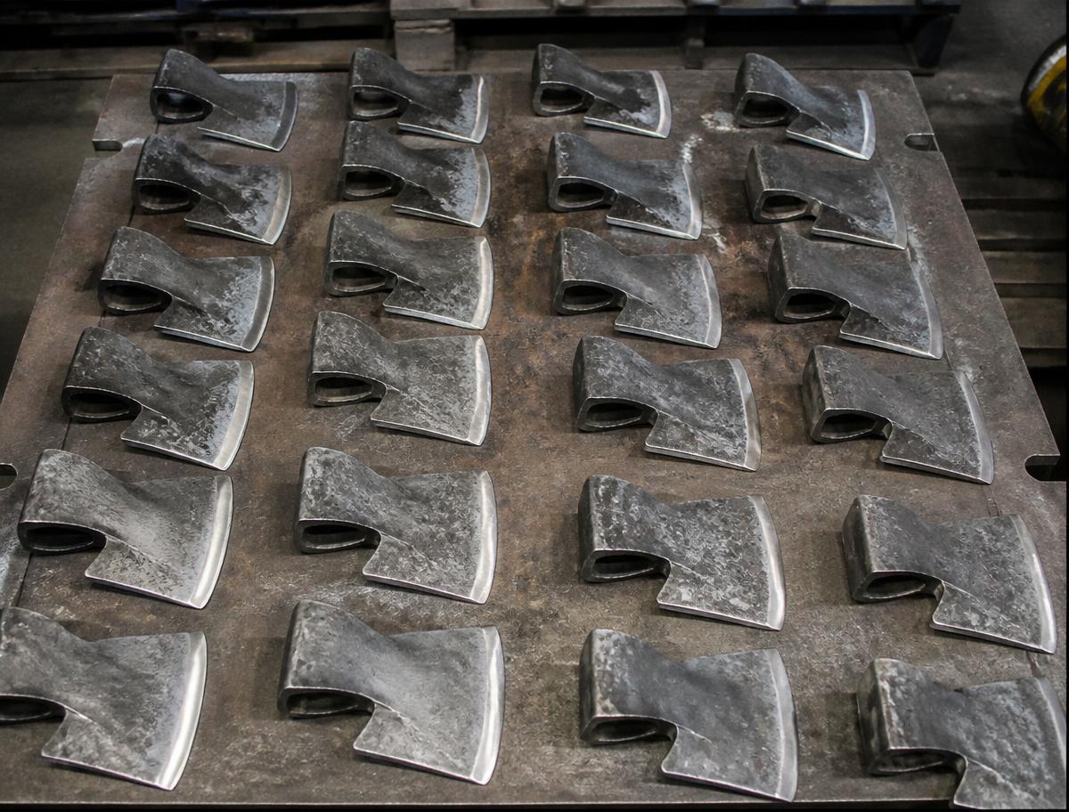 Rows of hammer heads on workbench